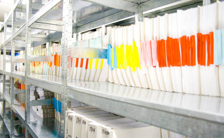 Folders stacked in archive of different document in archives sector