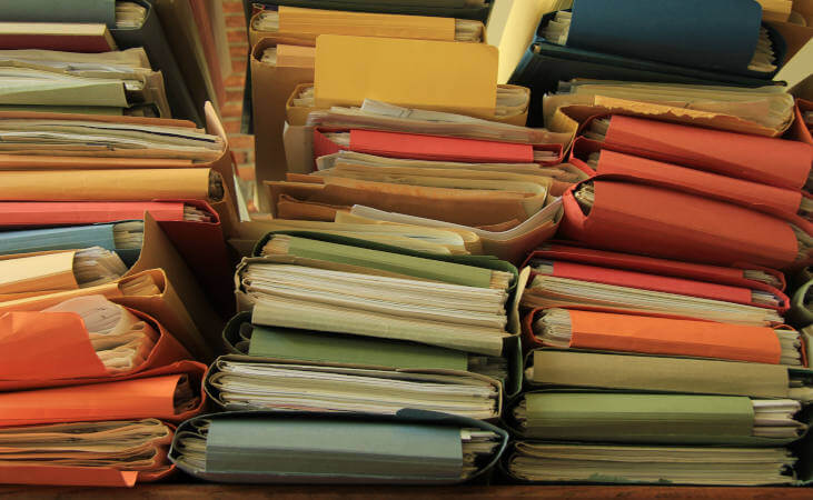 Stacked office files: pile of files in an office